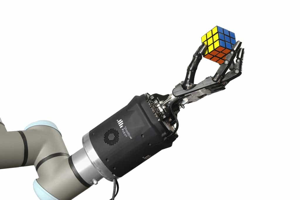 Shadow Dexterous Hand triumphantly holding a rubiks cube